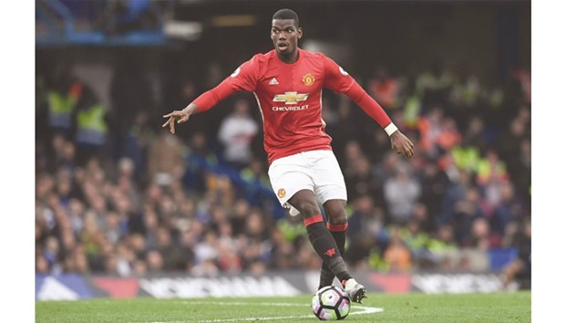 This file photo taken on October 23, 2016 shows Manchester Unitedu2019s French midfielder Paul Pogba during the English Premier League football match against Chelsea.