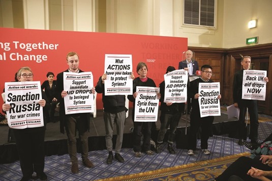 Protesters led by Peter Tatchell have disrupted a speech by Jeremy Corbyn, calling on the Labour leader to demand action to end the conflict in Syria. Corbyn halted his speech while several protesters held up banners with slogans including: u201cStep up and demand action in Syriau201d and u201cEnd the suffering in Aleppou201d.