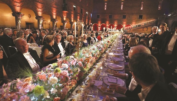Guests attend the 2016 Nobel Banquet at the Stockholm City Hall yesterday in Stockholm.