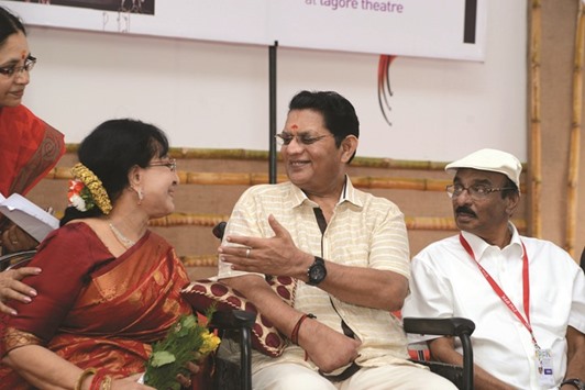Jagathy Sreekumar speaks to Sheela, as filmmaker IV Sasi looks on at the IFFK venue.