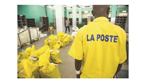 A postman works at a branch of the Congolese Company for Posts and Telecommunications (SCPT) in Kinshasa.