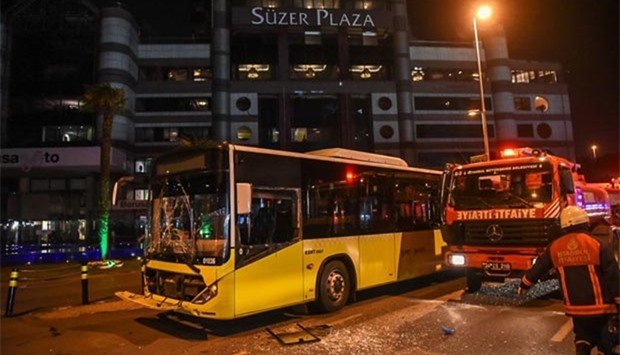 A damaged public transport bus is seen at the site where a car bomb exploded near the stadium of football club Besiktas in central Istanbul on Saturday.