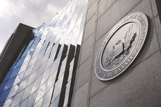 The US Securities and Exchange Commission headquarters is seen in Washington. For four decades, banks, investment funds, major corporations and financiers who  cheated investors, paid bribes or destabilised markets through illegal practices knew they could resolve matters with the SEC while almost never having to admit wrongdoing.