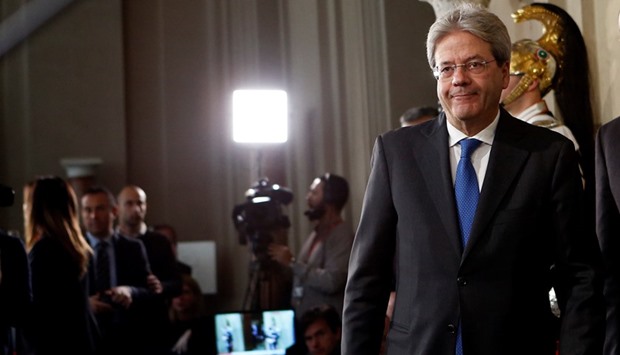 Gentiloni leaves after receiving the mandate to form the countryu2019s new government at the Quirinal Palace in Rome.