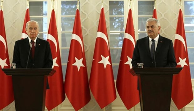 Turkish Prime Minister Binali Yildirim and opposition Nationalist Movement Party (MHP) leader Devlet Bahceli hold a news conference after their meeting in Ankara on Thursday.