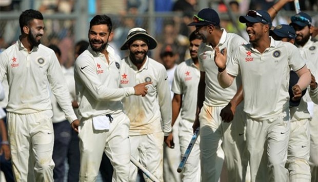India captain Virat Kohli celebrates with his teammates after winning the fourth Test against England at the Wankhede Stadium in Mumbai on Monday.