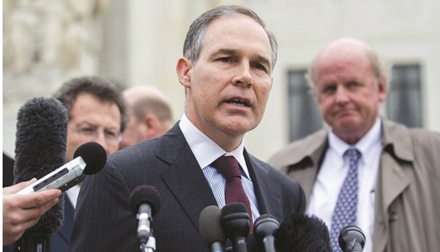 Scott Pruitt, attorney-general of Oklahoma (centre), speaks to the media in front of the US Supreme Court in Washington, DC. Refinery owners including Carl Icahn attacked the EPA in the past year over rising costs to comply with renewable fuel mandates, including credits linked to Renewable Identification Numbers (RINs).