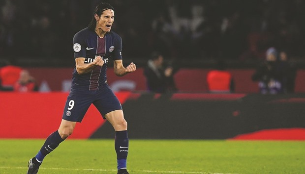 Paris Saint-Germainu2019s Uruguayan forward Edinson Cavani celebrates after scoring a goal against Nice at the Parc des Princes stadium.