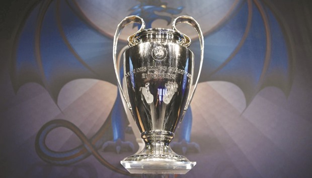 The UEFA Champions League trophy is displayed before the round of 16 draw of the UEFA Champions League football tournament at the UEFA headquarters in Nyon.
