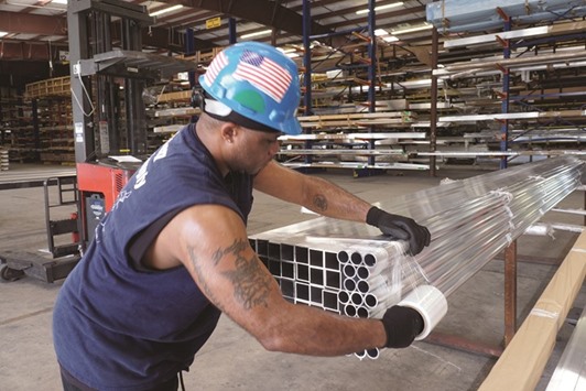 A worker prepares an order of aluminium materials for shipping at the Eastern Metal Supply facility in Lake Worth, Florida. The Institute for Supply Management (ISM) said its index of US national factory activity rose 1.3 percentage points to a reading of 53.2 last month, the highest since June.