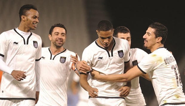 Al Saddu2019s Pedro (centre) celebrates his goal with teammates Xavi (second from left), Baghdad Bounedjah (right) and others during their Qatar Stars League match against Umm Salal at the Jassim Bin Hamad Stadium yesterday. PICTURES: Shemeer Rasheed