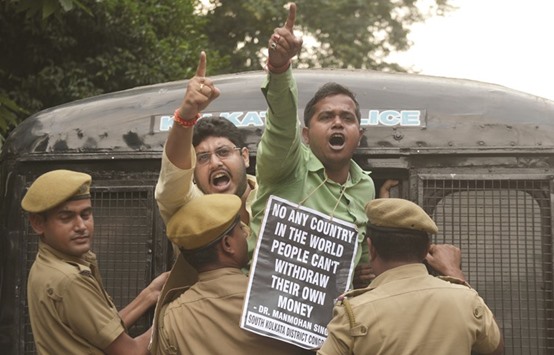 Police arrests Congress activists shouting slogans against Prime Minister Narendra Modi during a protest march against the current demonetisation, in Kolkata yesterday.