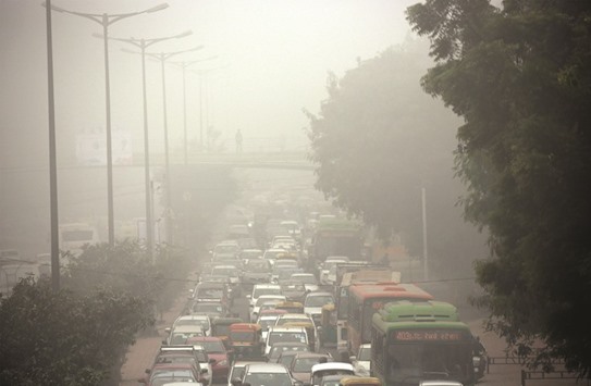 Traffic comes to a standstill due to heavy fog in Delhi yesterday.