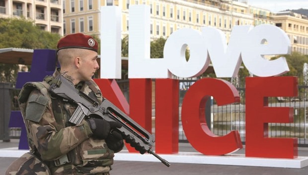 A French soldier is seen on patrol yesterday as part of the u2018Vigipirateu2019 security plan in Nice.