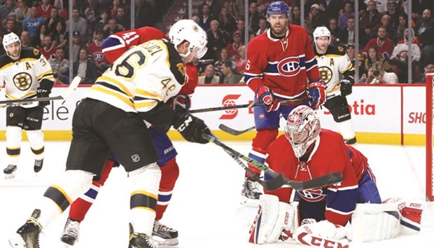 Montreal Canadiens goalie Carey Price makes a save against Boston Bruins center David Krejci (No 46) as left wing Paul Byron (No 41) defends during the first period at Bell Centre. PICTURE: USA TODAY Sports