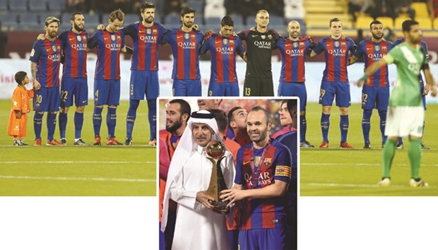TOP PHOTO: Barcelona players.  BOTTOM PHOTO: Qatar Airways CEO Akbar al-Baker (L) hands over the trophy to Barcelona captain Andres Iniesta yesterday. Pic: Noushad Thekkayil