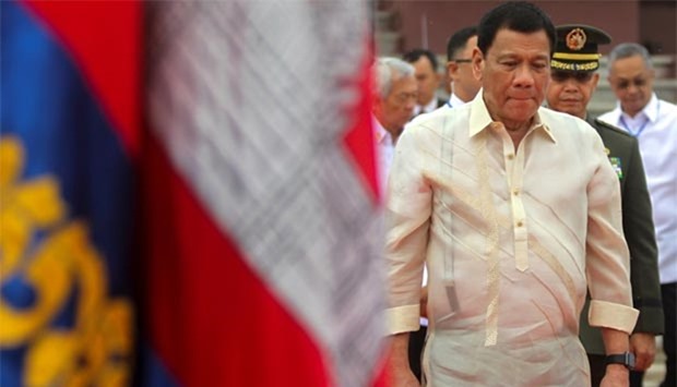 Philippine President Rodrigo Duterte leaves after paying respects to a statue of the late king Norodom Sihanouk in Cambodian capital Phnom Penh, on Wednesday.