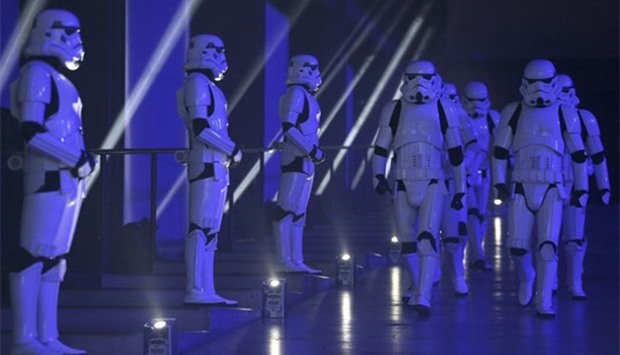 Actors in Storm Trooper costumes take part in the European premiere of Star Wars Rogue One at the Tate Modern in London on Tuesday.