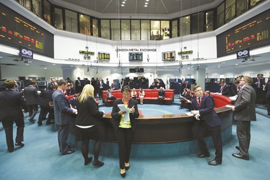 Traders stand outside the open outcry pit following a trading session at the London Metal Exchange. The LME, the worldu2019s largest base-metals exchange, found so much promise in precious metals that it announced in August plans to start offering cleared gold and silver contracts in the first half of 2017.