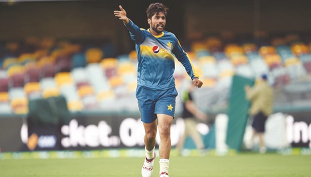 Pakistani paceman Mohamed Amir gestures during a practice session at Gabba in Brisbane on the eve of a day and night cricket Test match against Australia.