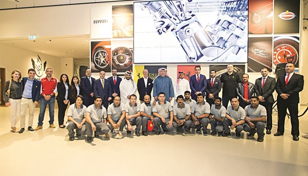 Omar Alfardan with officials and employees.