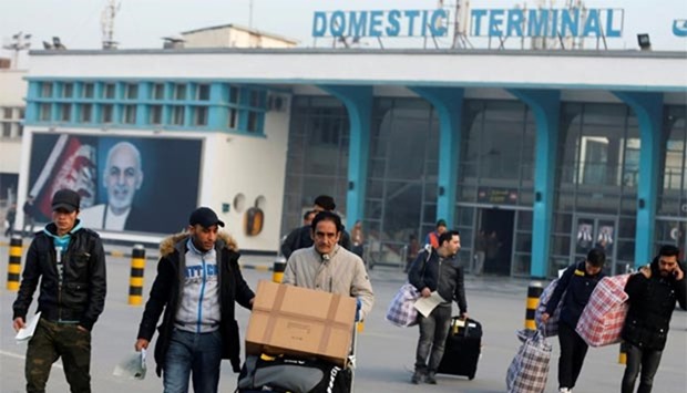 Afghans, whose asylum applications have been rejected by Germany, arrive in Kabul airport on Thursday.