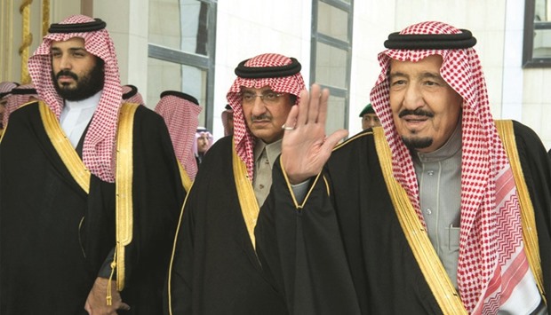 Saudi King Salman waves as he arrives to address the consultative Shura Council, in Riyadh, yesterday.