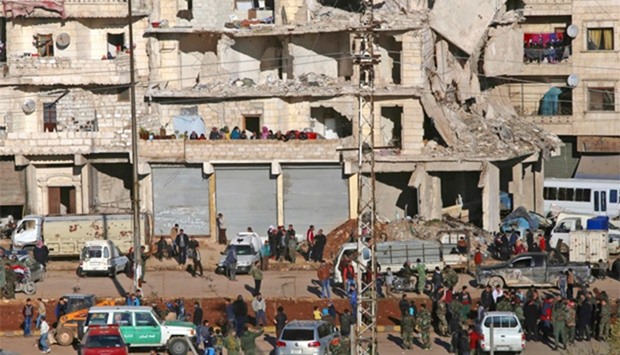 Aleppo's Salaheddin neighbourhood watch from their damaged homes