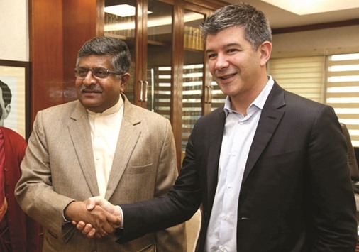 Indiau2019s Minister of Law and Information and Technology Ravi Shankar Prasad gestures as he talks to Uber CEO Travis Kalanick before the start of their meeting in New Delhi yesterday. u201cWe see the path to profitability in India and we feel pretty good about that,u201d Kalanick said in a public interview hosted by Amitabh Kant, the head of Indiau2019s planning commission.