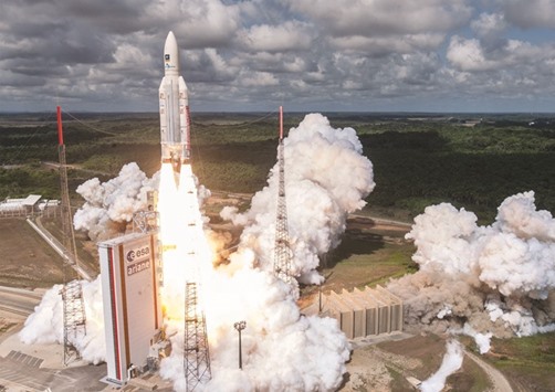 This file photo taken on November 17 released by the European Space Agency (ESA), the Centre Bational du2019Etudes Spatiale (CNES, the French government space agency) and the Arianespace satellite launch company shows the Ariane 5 rocket with a payload of four Galileo satellites lifting off from ESAu2019s European Spaceport in Kourou, French Guiana. Seventeen years and more than u20ac10bn ($11bn) later, Europeu2019s Galileo satnav system went live yesterday.
