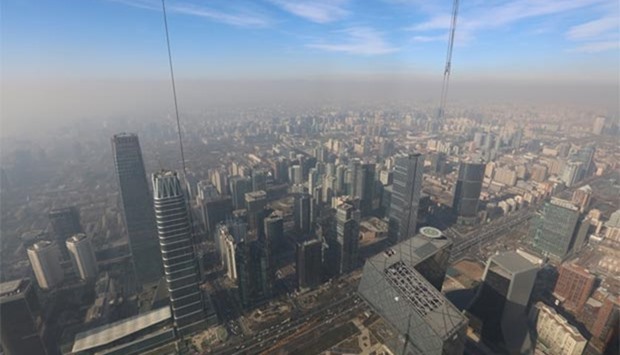 Smog is seen over the city as a red alert for air pollution is issued in Beijing.