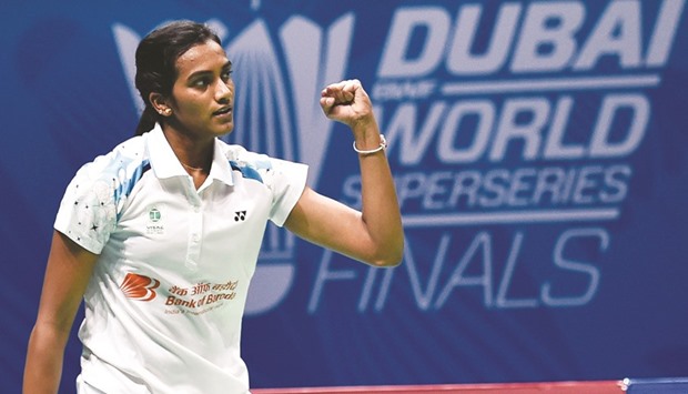 PV Sindhu celebrates after winning against Carolina Marin in their womenu2019s singles match on the third day of the BWF Dubai World Superseries Finals in Dubai yesterday. (AFP)