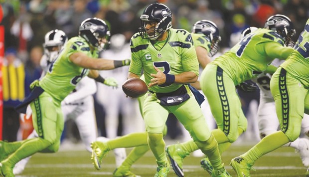 Quarterback Russell Wilson (No 3) of the Seattle Seahawks prepares to handoff the ball against the Los Angeles Rams at CenturyLink Field in Seattle. (Getty Images/AFP)