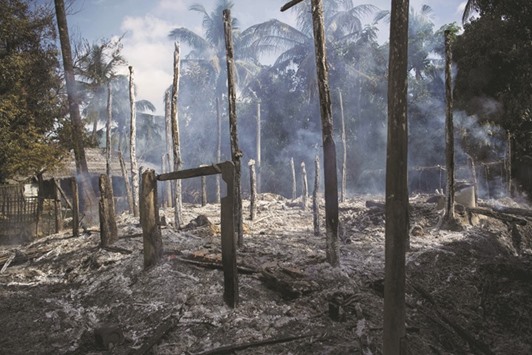 This file photo taken on October 14 shows smouldering houses in Warpait village, a Muslim village in Maungdaw, Rakhine State.