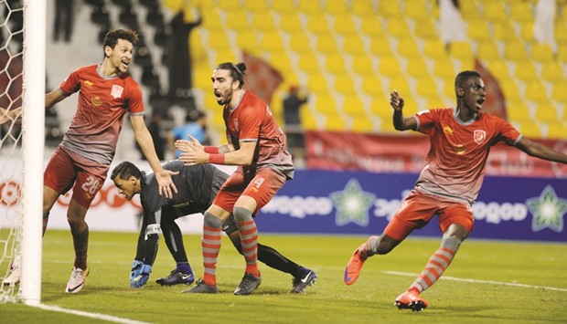 Lekhwiyau2019s Almoez Ali (right) celebrates after scoring the winner against Al Ahli during their QSL match yesterday. PICTURE: Shemeer Rasheed
