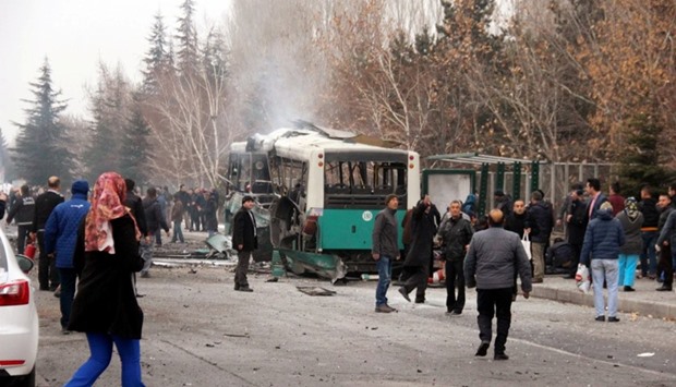 People react after a bus was hit by an explosion in Kayseri, Turkey.