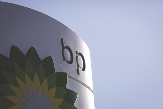 A BP logo is displayed outside a gas station in London. The UKu2019s second-biggest oil group will issue new ordinary shares to pay for 10% of the Abu Dhabi Company for Onshore Petroleum Operations, giving the emirate a 2% holding in BP, the London-based company said in a statement.