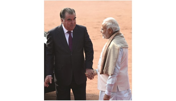 Prime Minister Narendra Modi welcomes Tajikistan President Emomali Rahmon during a ceremonial reception in New Delhi yesterday.