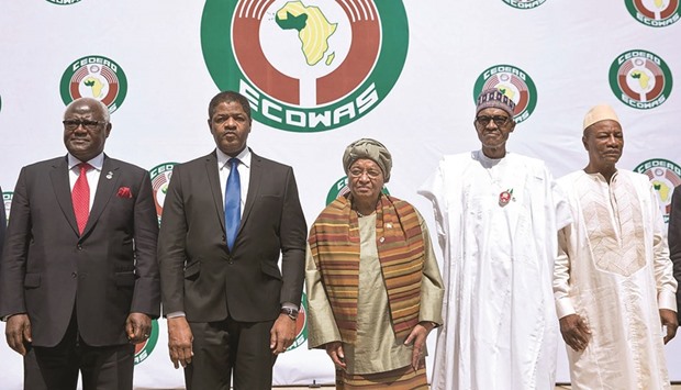 From left: Sierra Leonu2019s President Ernest Bai Koroma, President of ECOWAS official Marcel Alain de Souza, Liberian President and Ecowas Chairperson Ellen Johnson Sirleaf, Nigerian President Muhammadu Buhari, right, and Guinean President Alpha Conde, centre, pose during the 50th summit of the 15-member Economic Community of West African States (ECOWAS) in Abuja, yesterday.
