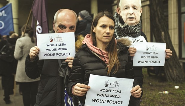 Demonstrators hold notices reading u2018Free Parliament, Free Media, Free Polesu2019 during a protest yesterday in Gdansk, Poland.