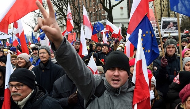 People shout slogans as anti-government protesters gather in front of the Constitutional Court to thank the outgoing head of court Andrzej Rzeplinski for his efforts to defend its independence, in Warsaw
