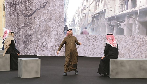 Renowned Qatari actors perform on stage.