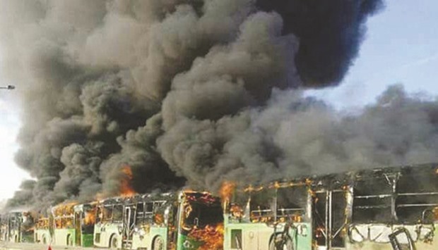 Buses burn after they were attacked in Idlib province in Syria yesterday. The buses were on their way to evacuate ill and injured people from the besieged Syrian villages of al-Foua and Kefraya when they were attacked.