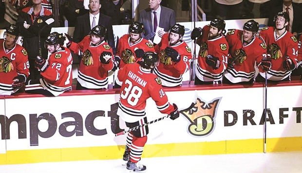 Chicago Blackhawks right wing Ryan Hartman celebrates his goal against the San Jose Sharks with his teammates during the third period at the United Centre. The Hawks won 4-1. PICTURE: USA TODAY Sports
