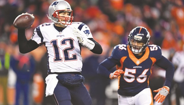 New England Patriots quarterback Tom Brady (R) attempts a pass in the second half against the Denver Broncos at Sports Authority Field. PICTURE: USA TODAY Sports