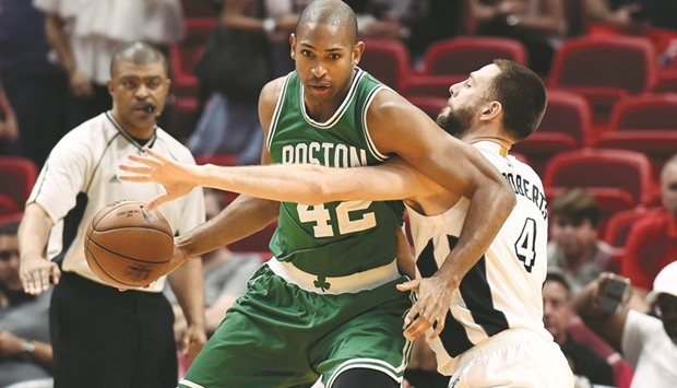 Boston Celtics center Al Horford (No 42) defended by Miami Heat forward Josh McRoberts during the first half at American Airlines Arena. PICTURE: USA TODAY Sports
