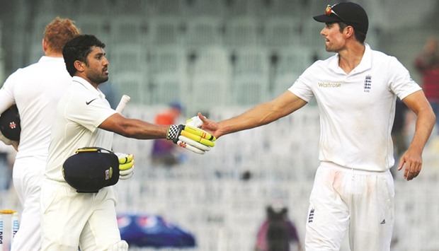 Englandu2019s captain Alastair Cook (right) greets Indiau2019s Karun Nair after the latter scored a triple-century on the fourth day of the fifth Test in Chennai yesterday. (AFP)