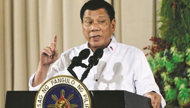President Rodrigo Duterte gestures as he delivers a speech during an awarding ceremony for outstanding Filipinos and organisations overseas, at the Malacanang Palace in Manila yesterday.