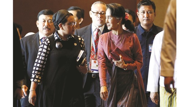 Indonesia Foreign Minister Retno Marsudi and Myanmar State Counsellor Aung San Suu Kyi walk after they attended the Asean Foreign Ministersu2019 Meeting on the Rohingya issue in Sedona hotel at Yangon yesterday.
