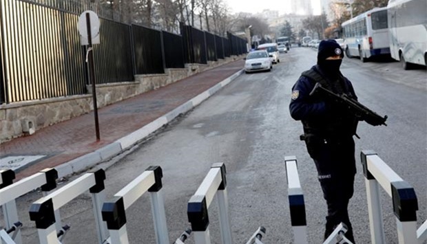 A Turkish police officer stands guard outside the Russian Embassy in Ankara on Tuesday.